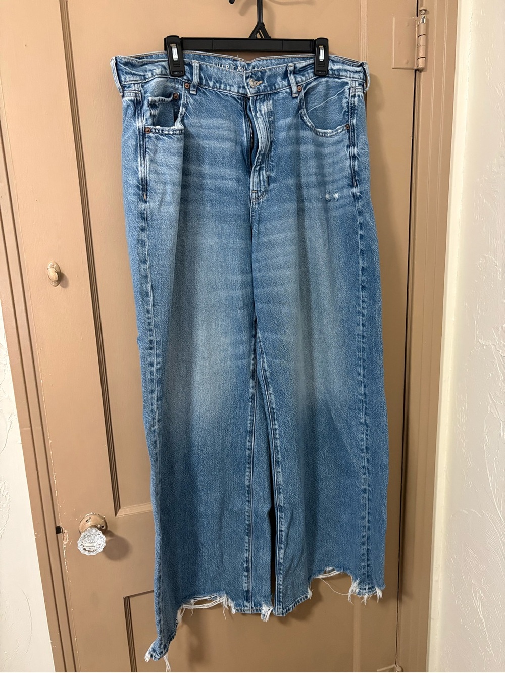 American Eagle Outfitters Faded Light Blue Wide-Leg Jeans with Frayed Hem